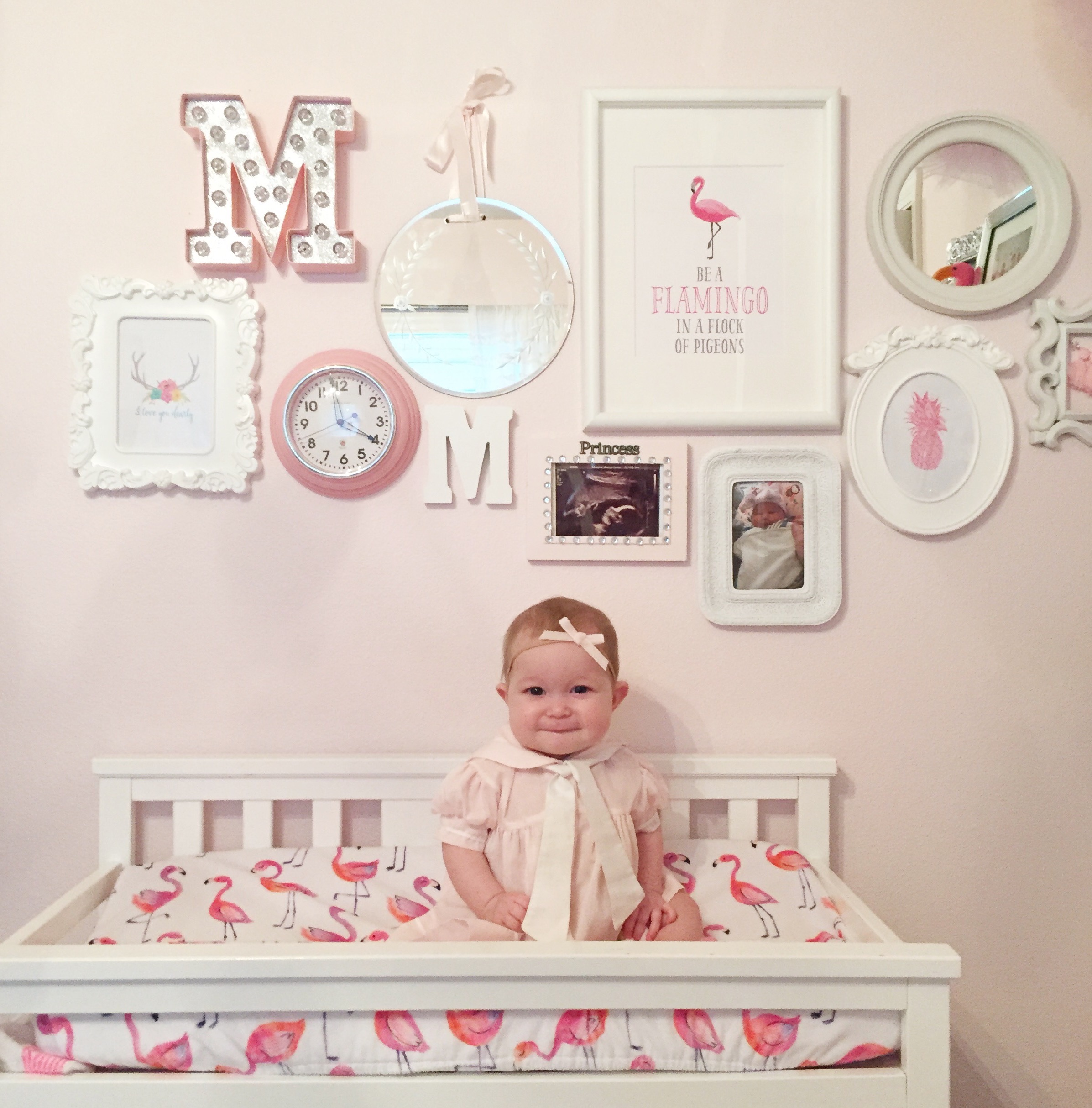 Gallery wall for girls nursery, changing table 